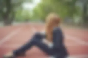 Cute Skinny Teen Girl in Leggings Sitting on the Sporting Ground