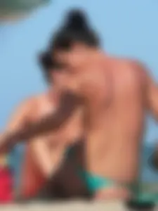 Bunch of sexy babes on the beach topless and in thong bikinis