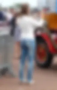Street candid booties in tight blue jeans