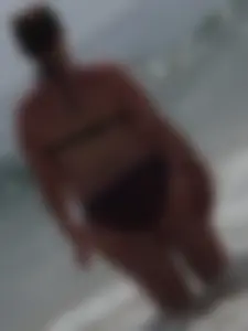 Fat chick with big boobs at the beach in a bikini
