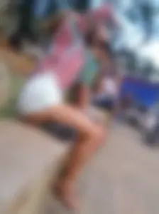 Leggy girl in shorts sitting