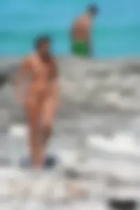 Older lady on a nude beach showing her body