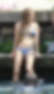 Sexy girl at the pool in a bikini with great tits