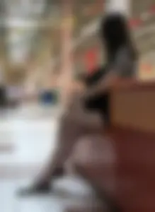 Girl with Hot Long Legs Sitting in the Mall Candid