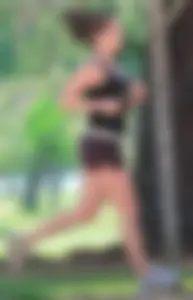Cute girl running in short shorts