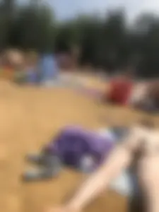 Topless Skinny Girl With Very Pale Skin Lying on a Beach on Her Tummy With Slightly Spread Legs Creepshots Gallery