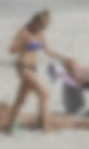 Florida blonde in blue and black bikini on the beach