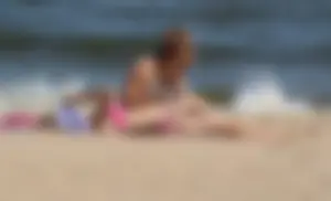 Two sexy beach teens in bikinis, one thick and one skinny with big boobs