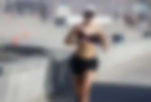 Awesome hot candid jogger girl wearing a bra and shorts, nice tummy