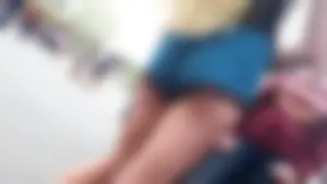 Perfect butt of a teen blonde in mini shorts street closeup