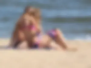 Two sexy beach teens in bikinis, one thick and one skinny with big boobs