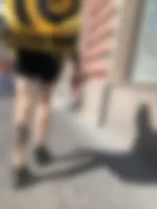 Amazing cute candid food delivery girl with lots of tattoos crossing the street
