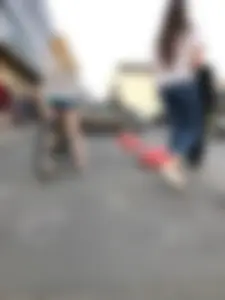Hot Blonde in Mini Shorts on the Bike City Candid