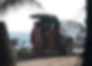 A sexy brunette and sexy blonde in bikinis at the beach