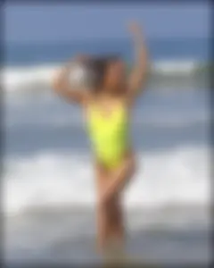 Sexy ass beach babe in a yellow thong swimsuit