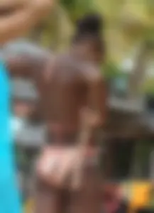 Sexy black babe in various bikinis on the beach while on vacation