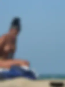 Hot ass topless beach girl with great tits lets her little brother oil up her ass in thong bikini