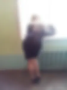 Girl in a Skirt on High Heels Bend Over the Windowsill Creepshot
