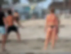 Thick white girls ass in a black thong bikini at the beach