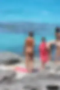 Older lady on a nude beach showing her body