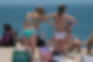 Bunch of sexy babes at the beach in bikinis
