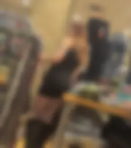 Redhead goth girl  in fishnets + tight dress