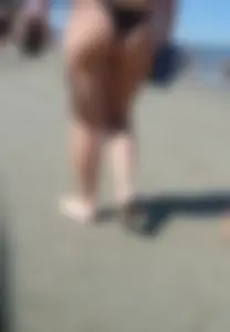 Thick bodied milf walking the beach in her black thong bikini praia especial