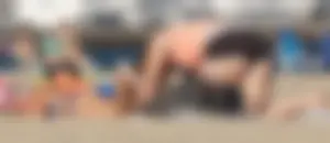 Beach babe in a blue bikini with thick friend in shorts