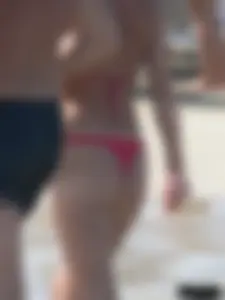 A bunch of hot babes on the beach in thong bikinis