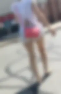 Sexy babe in short jeans shorts on the phone