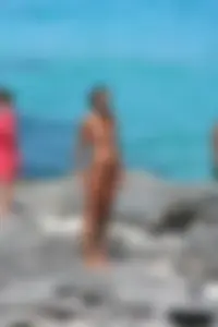 Older lady on a nude beach showing her body