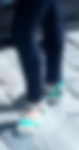 Teen feet in sandals and pantyhose on the street closeup photos