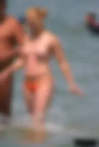 A bunch of sexy beach voyeur babes in bikinis, thongs and topless