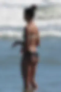 Beach girl out in a bikini with a nice round big booty