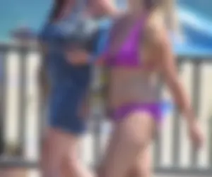 Sexy thick blonde girl in purple bikini