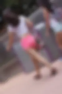 Sexy girl in pink shorts showing some cheek