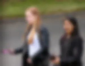 Redhead and ethnic skinny teens in tight jeans