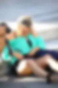 Blonde lady upskirted showing her panties and pussy lips