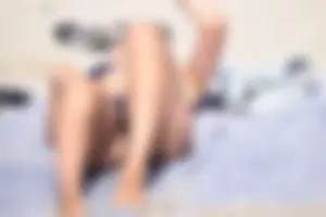 Blue bikini girl on the beach with a great ass and a little pussy lips slips