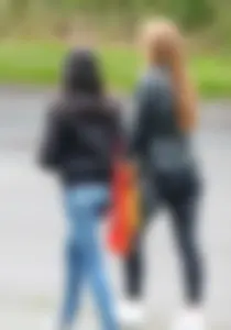 Redhead and ethnic skinny teens in tight jeans