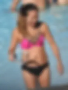 Asian milf in black and pink bikini at the beach