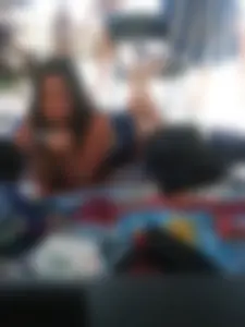 Sexy brunette teen in blue swimsuit by the pool
