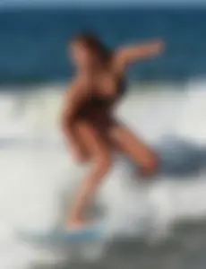 Hot surfer chicks out in the water
