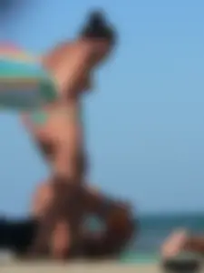 Bunch of sexy babes on the beach topless and in thong bikinis