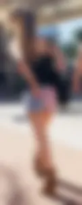 Cute girl with glasses in USA shorts showing her cheeks
