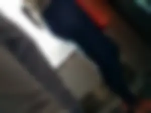 Train girl in tight jeans with a nice ass standing around