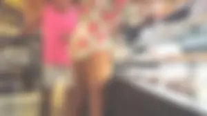 Blond milf shopping for groceries shows a hint of cheeks