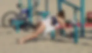 Beach teen in semi thong bikini under see through dress on the beach