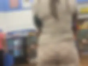 Sexy ebony babe with a nice ass in leggings waiting in line