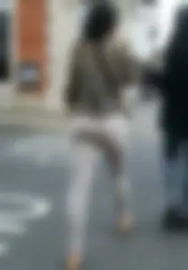 Brunette lady with a nice ass in light grey leggings walking